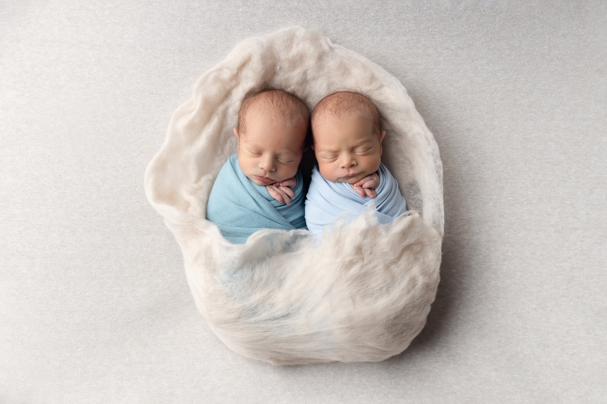 Photo Taken of 2 Babies Wrapped in Swaddling